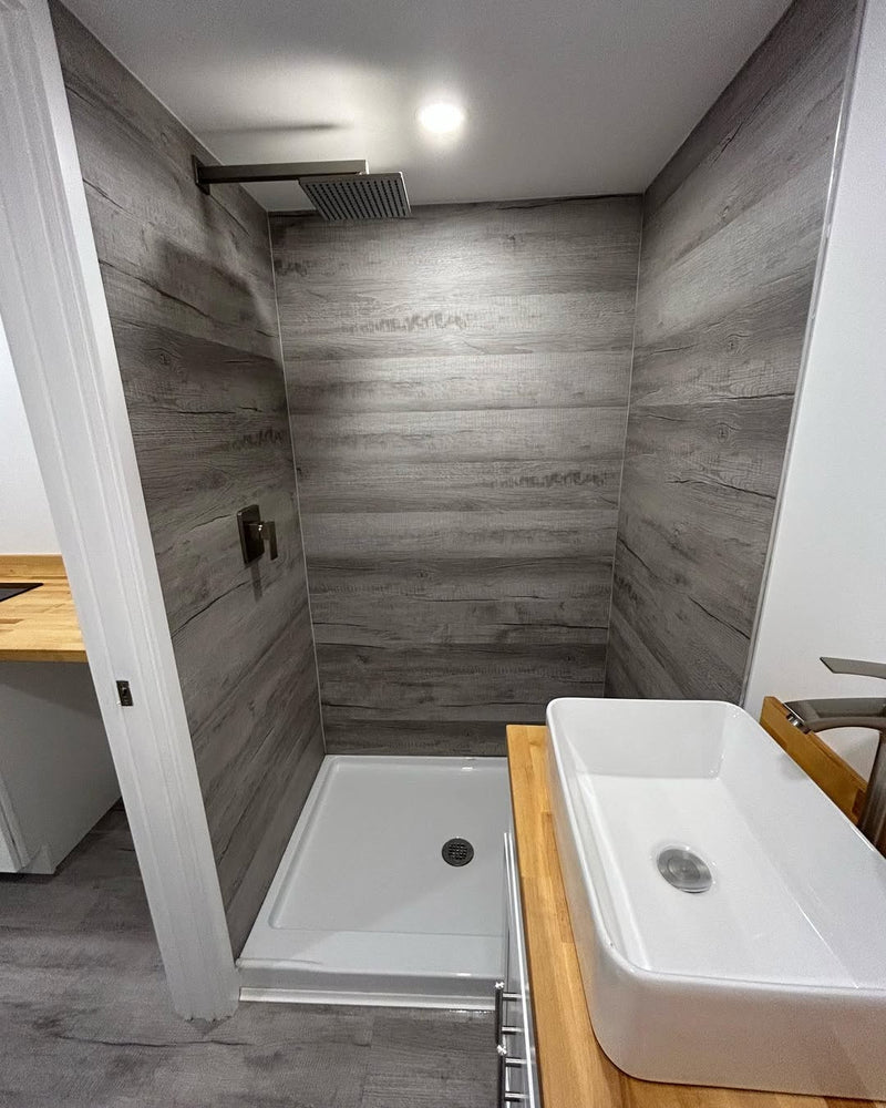 Bathroom with shower area and sink